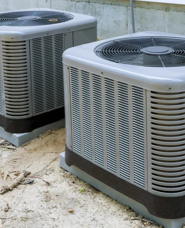 air-conditioner-units-outside-near-foundation-wall-2026-03-24-23-57-55-utc